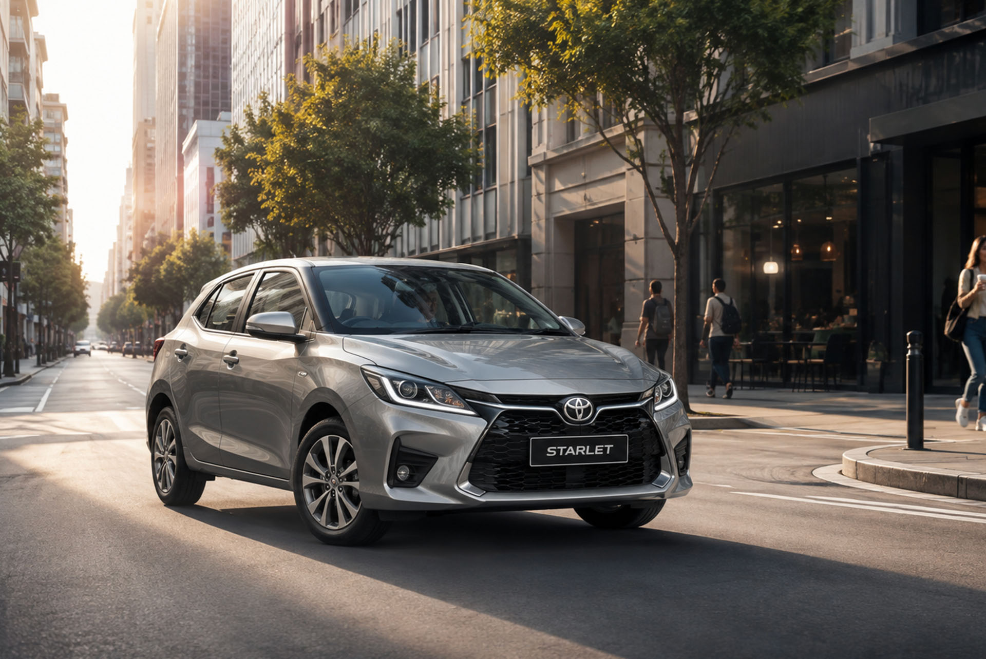 Compact Toyota hatchback moving through dense city traffic